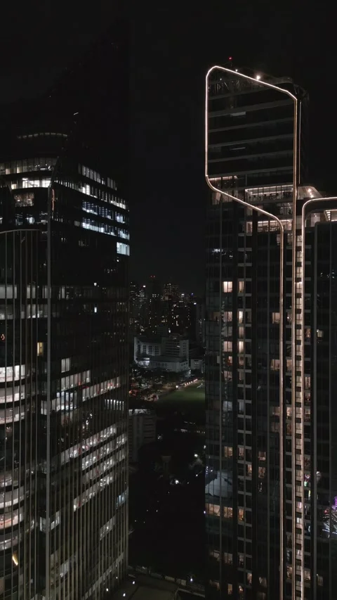 Night Drone Flying Down Between Urban Skyscrapers in Bangkok, Thailand Stock-Footage 331339286