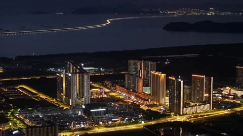 Night drone perspective of Batu Kawan township and coastal causeway Stock Footage 332160550