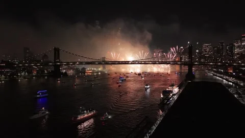 Night drone view of Macy's Fourth of July fireworks celebration in New York Stock Footage 312930930
