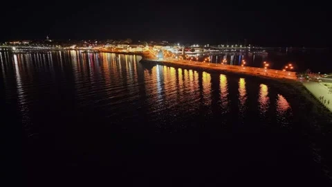 Night Drone View of Nesebar Isthmus with Bright Streetlight Reflections Stock Footage 343168882