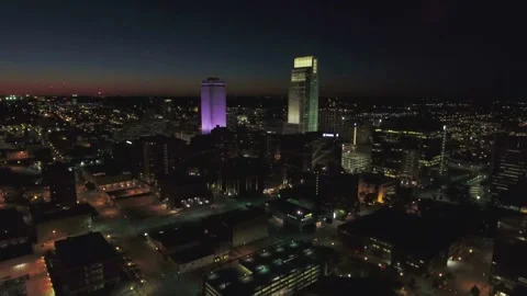 Night drone view over downtown Omaha Nebraska displaying glowing street lights 스톡 동영상 344566246