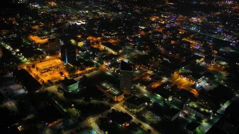Night drone view over downtown Wichita Kansas showing cityscape lights Stock Footage 344728243