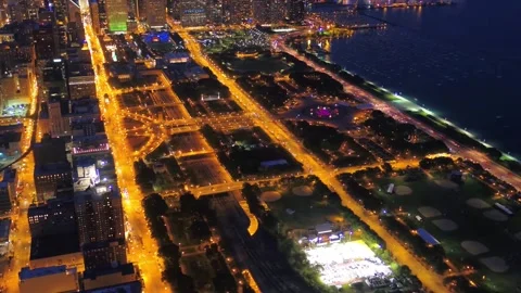 Night drone view over downtown Chicago Illinois showing Lake Michigan Stock Footage 344779686
