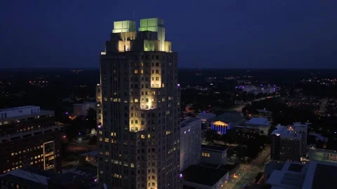 Night drone view over Raleigh North Carolina showing glowing skyscrapers Stock Footage 344641908