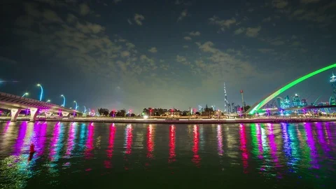 Night dubai canal reflection downtown crossing bridge panorama 4k time lapse uae Stock Footage 75012671
