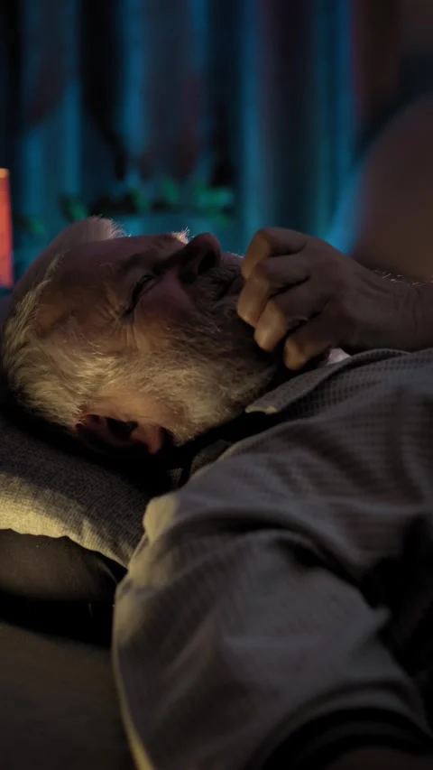 At night, elderly man is in bed in a deep sleep. He snores loudly Stock Footage 329277396