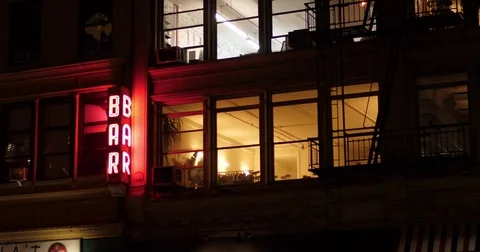 Night Exterior Establishing Shot of Apartments Over Manhattan Bar  	 Stock Footage