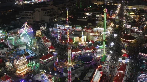 A night at the fair! The camera pulls back while panning down to show a Stock Footage 122070132