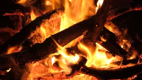 The night fire sparkles and creates a warm mood and comfort Stock Footage 196360070