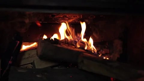 Night by the fireplace. A flame is burning in the fireplace Stock Footage 258836013