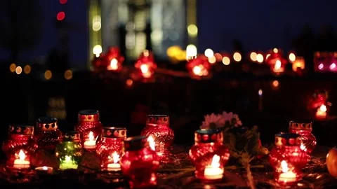 Night fires burn in small red lamps during the Holodomor memorial ceremony. Stock Footage 144113757