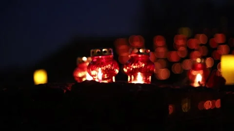 Night fires burn in small red lamps during the Holodomor memorial ceremony. Stock Footage 144113758