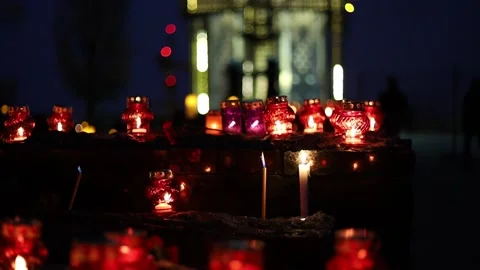 Night fires burn in small red lamps during the Holodomor memorial ceremony. Stock Footage 144113772