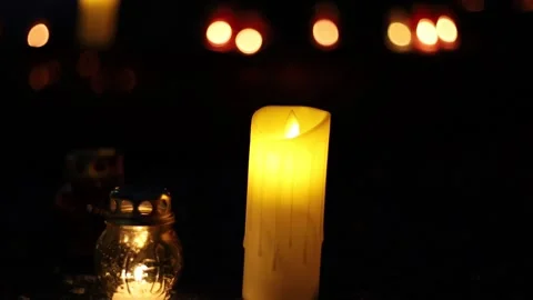 Night fires burn in small red lamps during the Holodomor memorial ceremony. Stock Footage 144113788