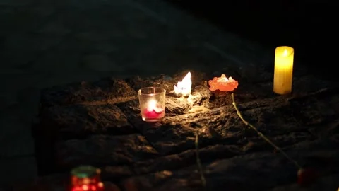 Night fires burn in small red lamps during the Holodomor memorial ceremony. Stock Footage 144113804