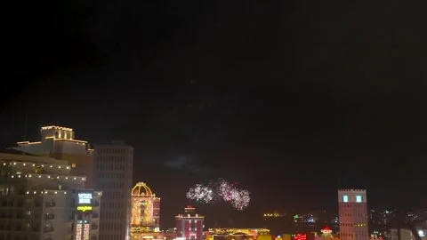 Night fireworks over Chatan cityscape in Okinawa, Japan Stock Footage 325631373