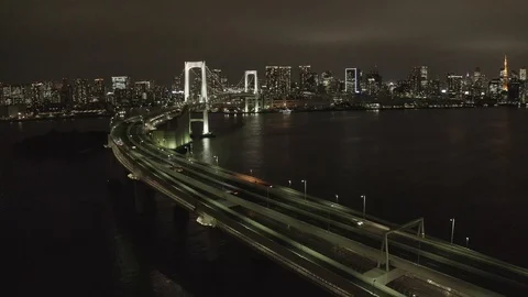 Night flight on the Copter over the bridge in the city of Tokyo Stock Footage 108033141