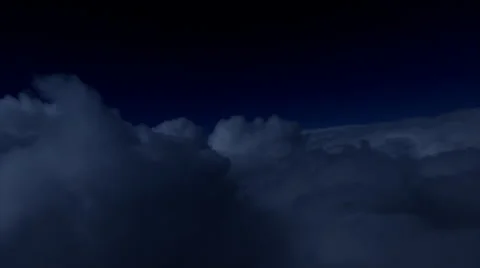 Night flight over clouds, tilting right