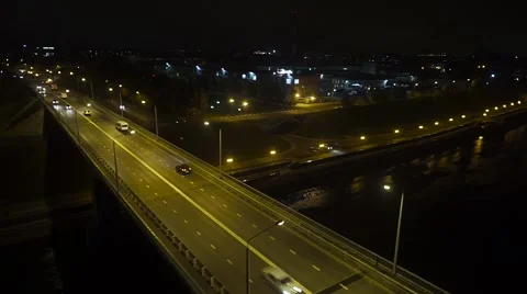 Night flight over the road bridge with heavy traffic Stock Footage 68880712