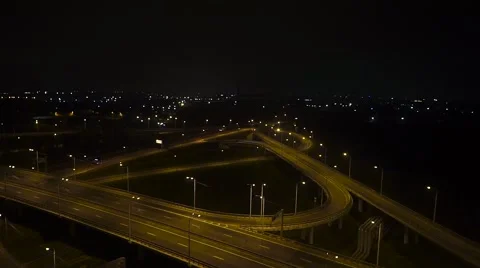 Night flight over the road bridge with heavy traffic Stock Footage 68881020