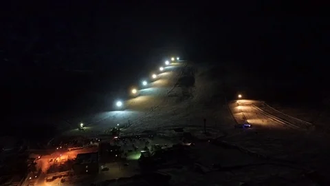 Night flight to the slope of the ski resort. Stock Footage 69936983