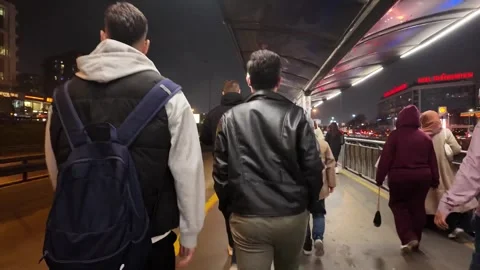Night Flow of Commuters at Cevizlibağ Metrobus Station ISTANBUL NOV 14 2024 Stock Footage 321408696
