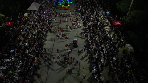 Night flyover of Carnaval parade route reveals brightly lit float 2025 Stock Footage 305837012
