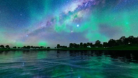 Night forest lake starry sky and northern lights Stock Footage 245249799