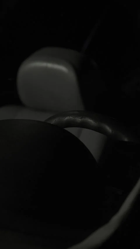 Night frame from the outside that includes the steering wheel and the interior. Video stock 257017509