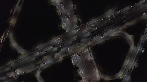 Night Freeway Overpass With Continuous Cross Traffic, Drone Top Down Stock Footage 345268457