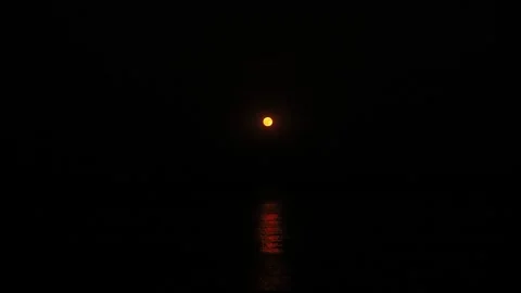 Night full moon rise through clouds on dark sky background. Stock Footage 319973643
