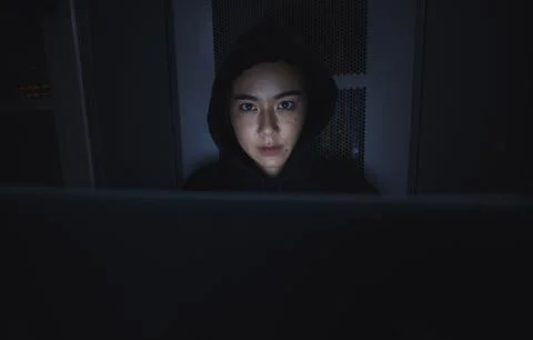 Night, hacker and cyber security with woman and laptop for coding, software and Stock Photos