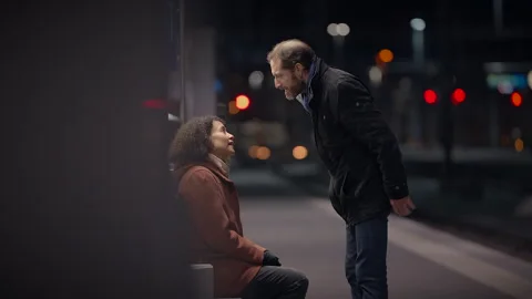 At night, a highstakes disagreement happens in a dramatic train station Stock Footage 280158062
