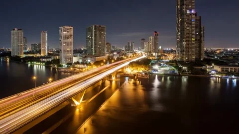 Night highway and river hyperlapse of Bangkok skyline Stock Footage 345545290
