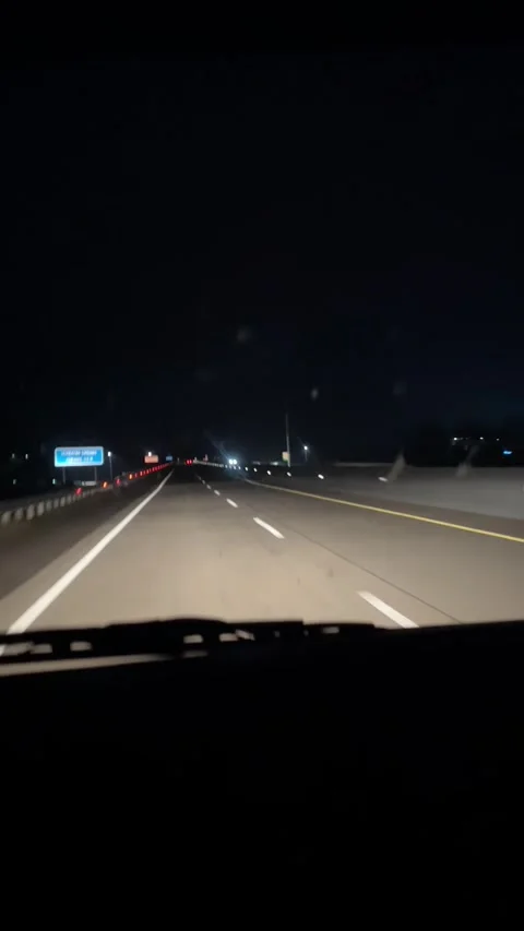 Night Highway Driving with Traffic Lights and Urban Transportation Stock Footage 337318699