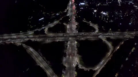 Night Highway Interchange With Continuous Traffic, Drone Overhead Stock Footage 345268382