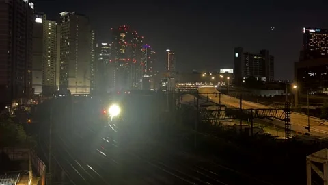 Night highway parallel to railroad with moving traffic. Busy highway, railroad Stock Footage 301521804