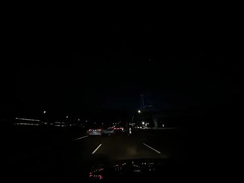Night highway traffic from driver perspective in Amsterdam Zuidas business Stock Photos