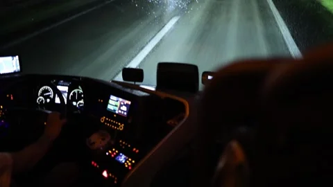 Night highway view from inside moving vehicle dashboard glowing with GPS screens Stock Footage 310856572
