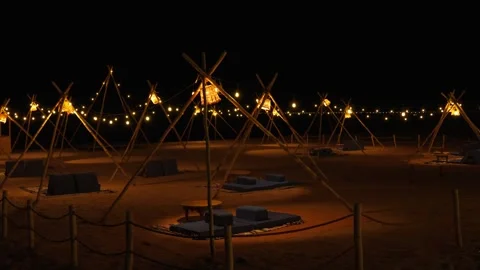 Night hookah bar on the sandy beach by the sea. Deserted. Stock Footage 347765516