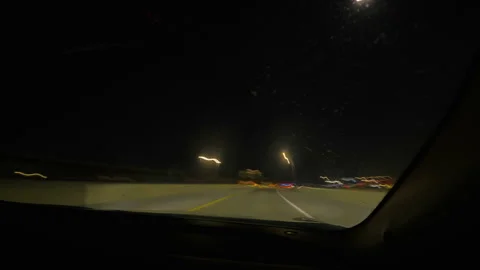 Night hyperlapse of driving along a freeway overpass, POV looking out passenger Stock Footage 333935923