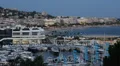 Night Illuminated Aerial View Cannes Skyline Festival Palace Yacht Sailboat Dusk HD Footage