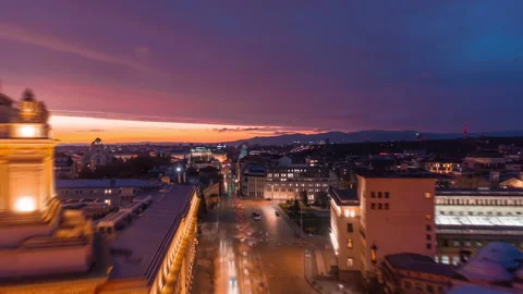 Night illuminated flight over Sofia downtown traffic aerial top down panorama Video stock 237775951