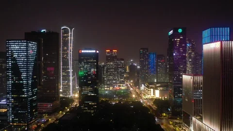 Night illumination hangzhou downtown traffic construction yard aerial 4k china Stock Footage 125488662