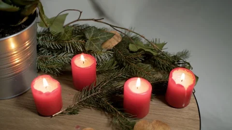 Night image of bedside table with authentic Chrismas decoration and lit candles. Stock-Footage 102658391