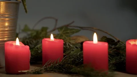 Night image of bedside table with authentic Chrismas decoration and lit candles. Video stock 102658460