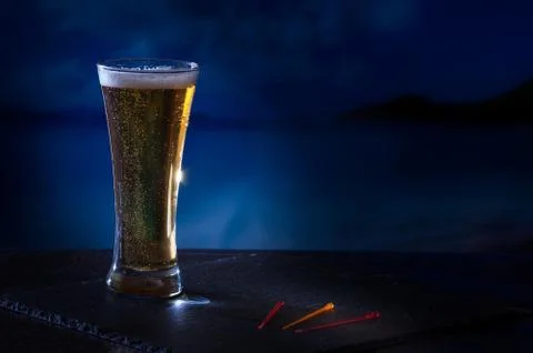 Night image of beer on the beach Stock Photos