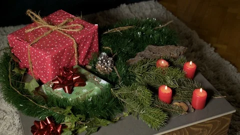 Night image of coffee table with authentic Chrismas decoration and lit candles. Stock Footage 102657766