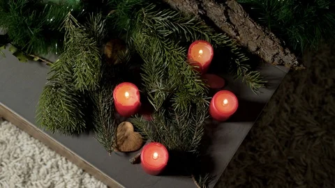 Night image of coffee table with authentic Chrismas decoration and lit candles. Stock Footage 102657870