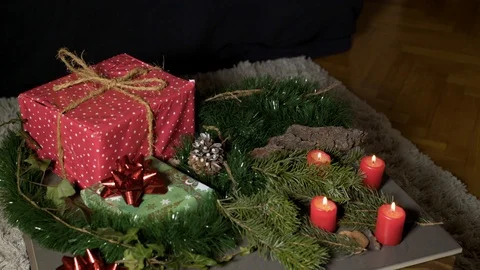 Night image of coffee table with authentic Chrismas decoration and lit candles. Stock Footage 102657937